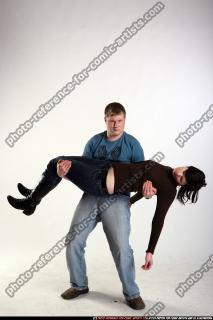 man-carrying-wounded-woman