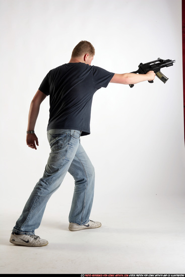 Man Adult Average White Fighting with submachine gun Standing poses Sportswear