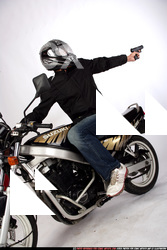 JANISONE BIKER SHOOTING BACK PISTOL 03.JPG