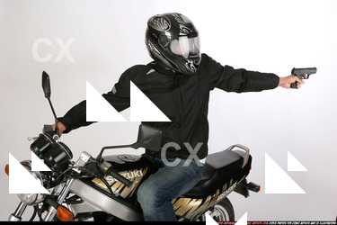 JANISONE BIKER SHOOTING BACK PISTOL 02.JPG