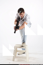 JANISONE MERCENARY STANDING ON CHAIR AIMING HK 01.JPG