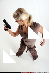Woman Young Athletic White Fighting with gun Standing poses Sportswear
