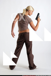 Woman Young Athletic White Fighting with gun Standing poses Sportswear