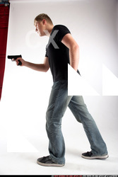 Man Adult Average White Fighting with gun Standing poses Sportswear