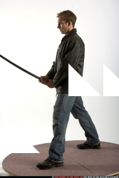 Adult Muscular White Fighting with sword Standing poses Sportswear