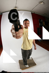 Man Adult Athletic White Fighting with gun Standing poses Sportswear