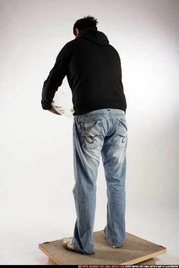 Man Adult Average Black Holding Sitting poses Sportswear