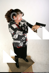 2009 08 PAULA STANDING AIMING PISTOL LIGHT 01 A.jpg
