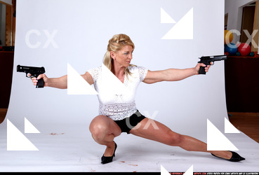 Woman Adult Muscular White Fighting with gun Kneeling poses Sportswear