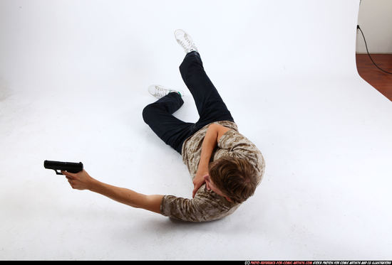 Man Young Athletic White Fighting with gun Laying poses Sportswear