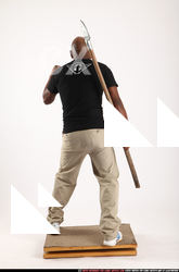 Man Old Average Black Fighting with spear Standing poses Casual