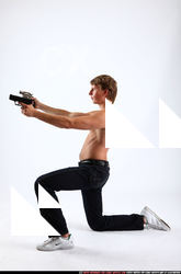 2010 09 PATRICK KNEELING SHOOTING DUAL PISTOLS 02 B