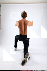 2010 09 PATRICK KNEELING SHOOTING DUAL PISTOLS 04 C