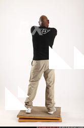 Man Old Average Black Fighting with gun Standing poses Casual