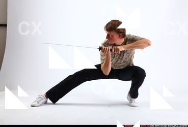 2010 10 PATRICK KNEELING KATANA DEFEND POSE 00