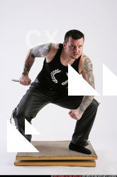 Man Adult Athletic White Fighting with knife Crouching Casual