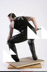 Man Adult Athletic White Fighting with knife Crouching Casual