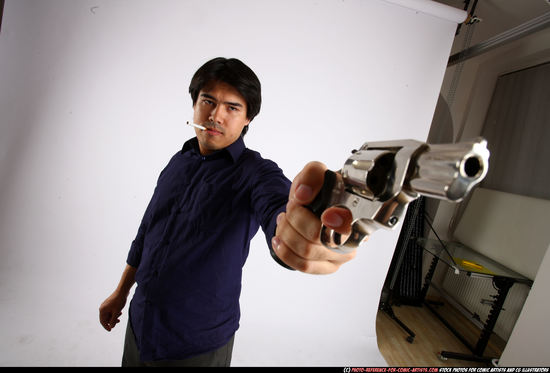 Man Adult Average Fighting with gun Standing poses Business Asian