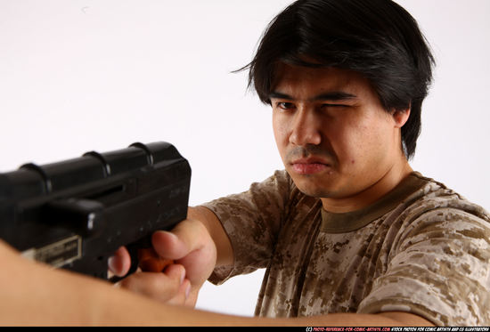Man Adult Average Fighting with submachine gun Standing poses Army Asian