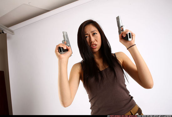 Woman Young Athletic Fighting with gun Standing poses Casual Asian