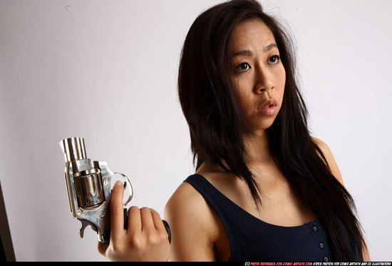 Woman Young Athletic Fighting with gun Standing poses Casual Asian