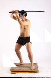 Man Adult Average Fighting with sword Standing poses Underwear Asian