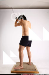 Man Adult Average Fighting with sword Standing poses Underwear Asian