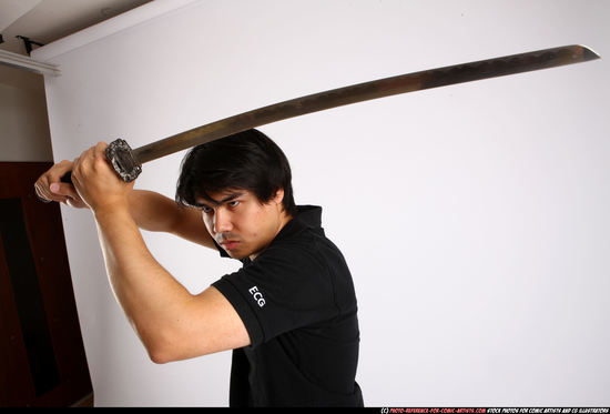 Man Adult Average Fighting with sword Standing poses Casual Asian