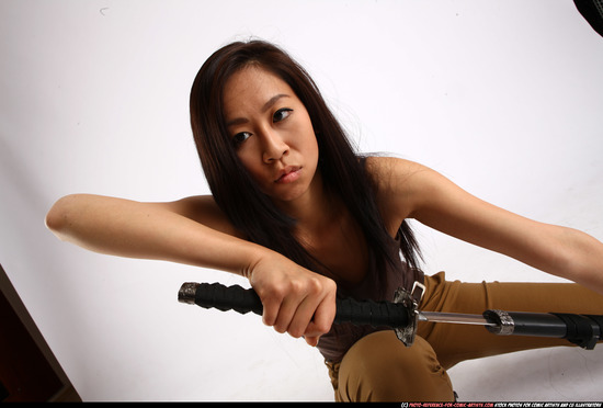 Woman Young Athletic Fighting with sword Kneeling poses Casual Asian