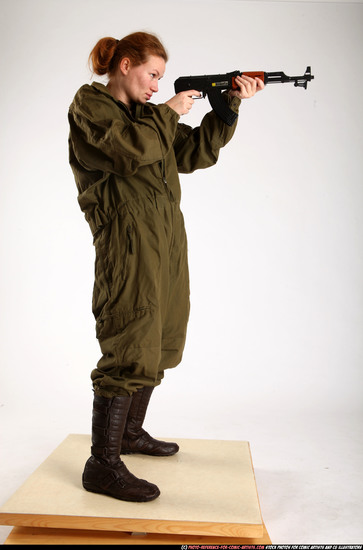 Woman Adult Average White Fighting with submachine gun Standing poses Army