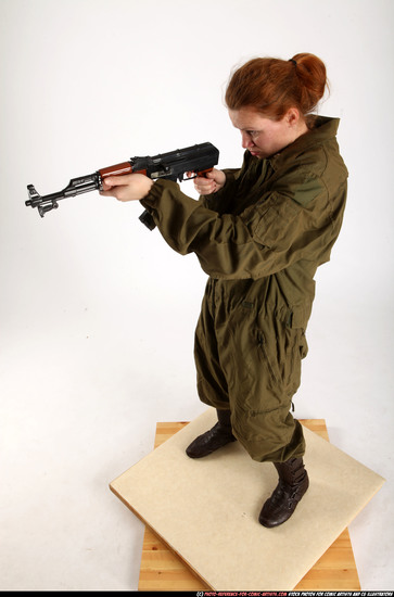 Woman Adult Average White Fighting with submachine gun Standing poses Army