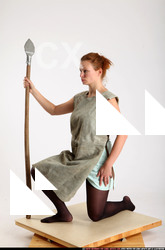 Woman Adult Average White Fighting with spear Kneeling poses Army