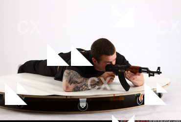 Man Adult Athletic White Fighting with submachine gun Laying poses Sportswear
