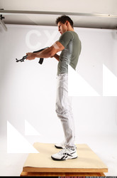 Man Adult Muscular White Fighting with submachine gun Standing poses Casual