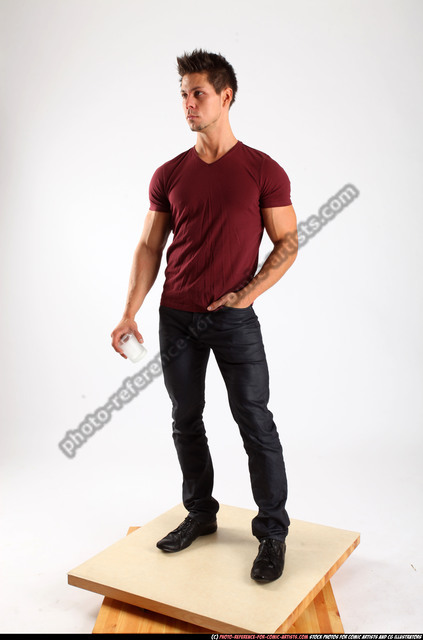 front view of a casual young man standing with his hands in his pockets  and… | Man standing, Photography poses for men, Male headshot poses