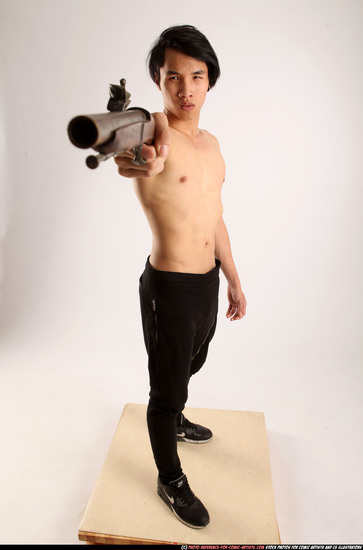 Man Young Athletic Fighting with rifle Standing poses Pants Asian