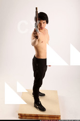 Man Young Athletic Fighting with rifle Standing poses Pants Asian
