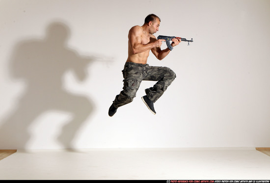 Man Adult Muscular White Fighting with submachine gun Moving poses Pants