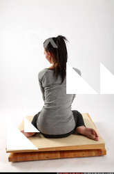 Woman Adult Athletic White Neutral Sitting poses Casual