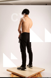 Man Young Athletic Fighting with gun Standing poses Pants Asian
