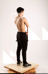 Man Young Athletic Fighting with gun Standing poses Pants Asian