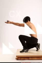 Man Young Athletic Holding Kneeling poses Pants Asian