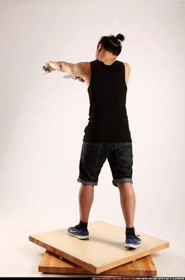 Man Young Athletic Fighting with gun Standing poses Casual Asian