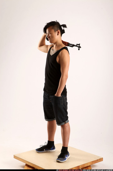 Man Young Athletic Fighting with submachine gun Standing poses Casual Asian