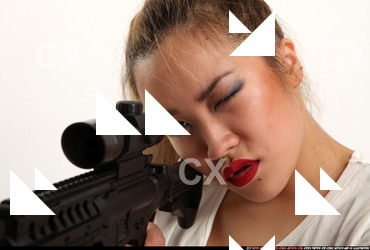Woman Young Average Fighting with submachine gun Sitting poses Casual Asian