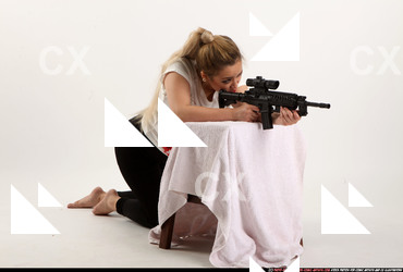 Woman Young Average Fighting with submachine gun Kneeling poses Casual Asian