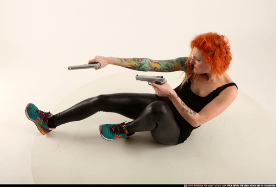 Woman Adult Athletic White Fighting with gun Laying poses Casual