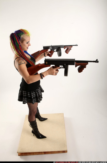 Woman Young Average White Fighting with submachine gun Standing poses Casual