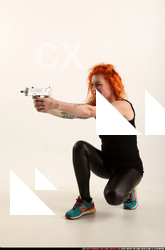 2016 05 ZORA KNEELING AIMING UZI 01 B