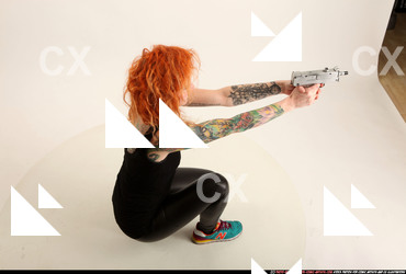 2016 05 ZORA KNEELING AIMING UZI 06 A